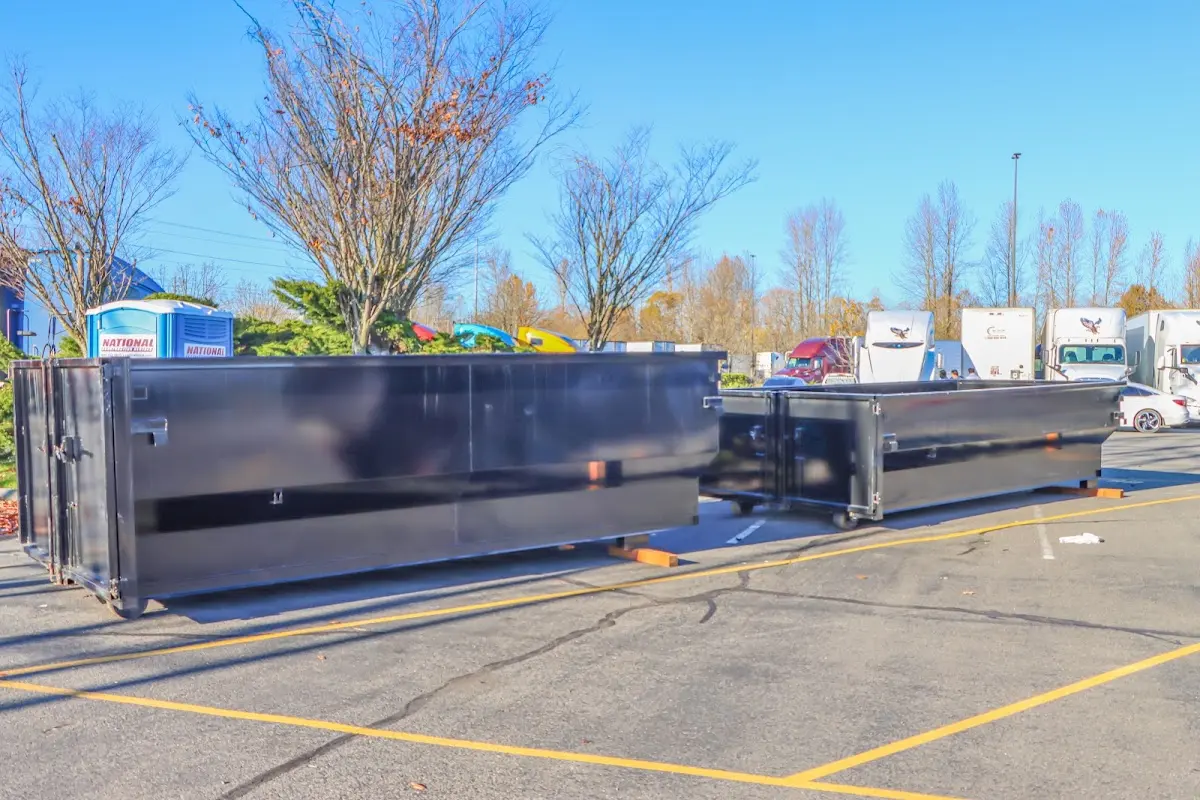 Professional dumpster rental service with roll-off container on residential driveway in Poulsbo